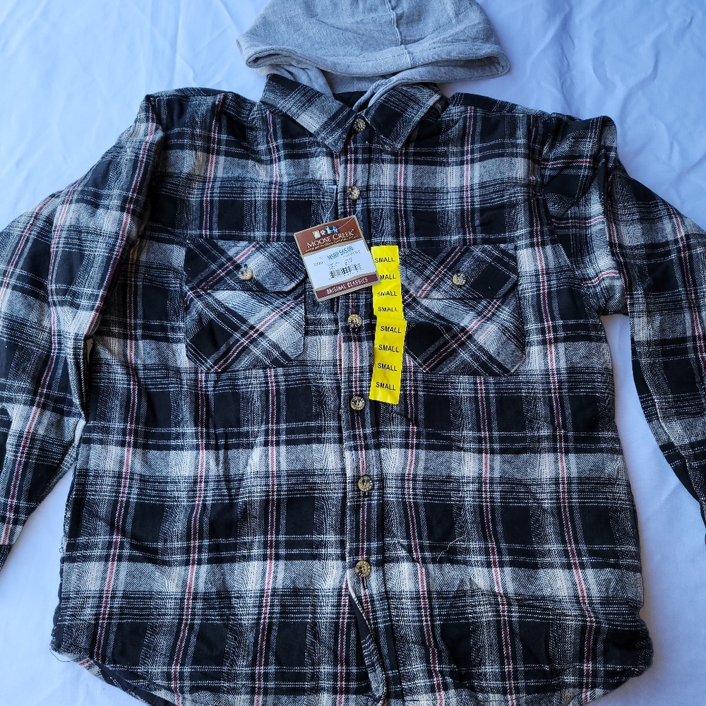 Moose Creek lined flannel jackets. Black/Cream. Full zip closure with buttons.